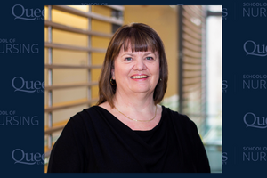headshot of Dr. Marian Luctkar Flude on a Queen's University navy blue backdrop 